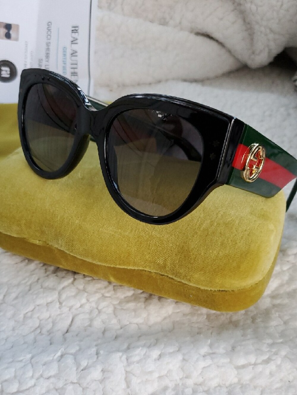 Gucci Glossy Black Cat-Eye Sunglasses with Green and Red Temple Stripe